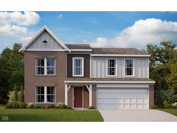 Charming two-story home featuring a brick facade, vertical siding, and an attached two-car garage at 7294 Broadview Ln, McCordsville, IN 46055