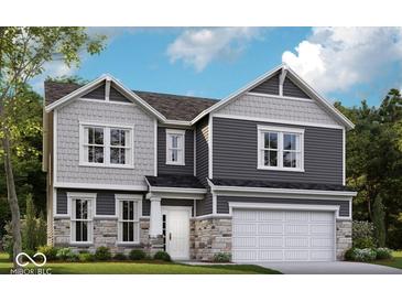 Charming two-story home with gray siding, stone accents, a two-car garage, and a well-manicured lawn at 7313 Deerberg Dr, Indianapolis, IN 46259