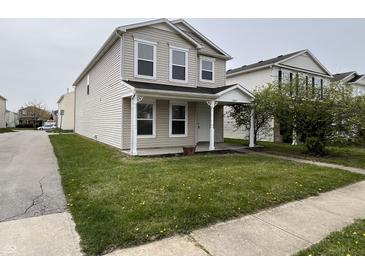 Charming two-story home featuring a well-maintained front yard and inviting porch at 12657 Republic Dr, Fishers, IN 46037