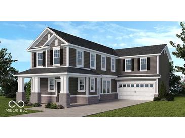 Charming two-story home with a covered porch and two-car garage at 13418 Vickery Ridge Dr, Fishers, IN 46037