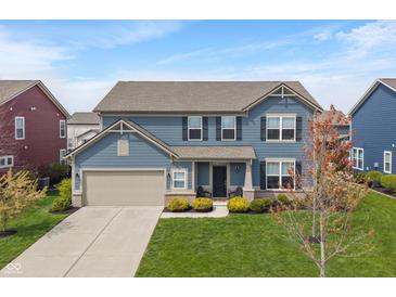 Beautiful two-story home with blue siding, a well-manicured lawn, and an attached two-car garage at 15723 Myland Dr, Noblesville, IN 46062