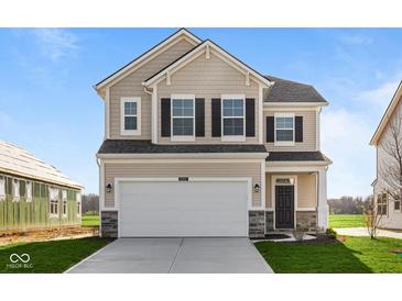 Beautiful two-story home with a two-car garage, manicured lawn, and classic architectural details at 2252 Marjorie Way, Shelbyville, IN 46176