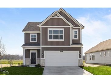 Charming two-story home featuring a two-car garage, neat landscaping, and a classic design at 2268 Marjorie Way, Shelbyville, IN 46176