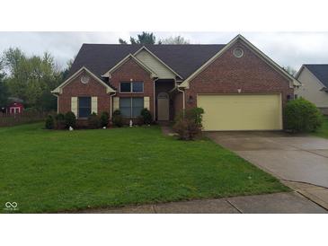Charming single-Gathering home featuring a well-manicured lawn and inviting front yard at 3237 Boxwood Dr, Indianapolis, IN 46227