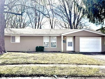 Cozy single-story home featuring a one-car garage, light brown siding and a well-maintained front yard at 3642 Horth Ct, Indianapolis, IN 46235