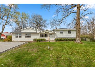 Charming one-story home with well-maintained lawn and mature trees at 1502 N Matthews Rd, Greenwood, IN 46143
