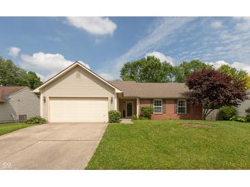 Charming single Gathering home with vinyl siding, brick accents, attached garage, and a well-manicured lawn at 1579 Winding Creek Trl, Brownsburg, IN 46112
