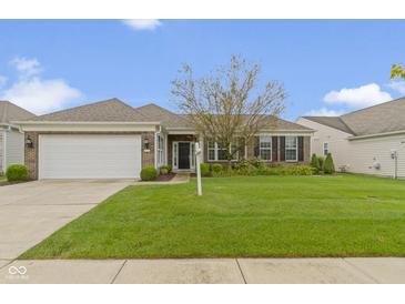 Charming single-story brick home with a well-manicured lawn and attached two-car garage at 16243 Oliver St, Fishers, IN 46037