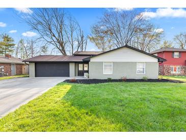 Charming ranch-style home featuring a freshly painted exterior and well-manicured lawn at 2815 Kay Ellen Dr, Indianapolis, IN 46229