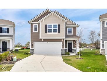 Charming two-story home featuring a two-car garage and classic architectural details at 5218 Triple Crown Way, Indianapolis, IN 46237