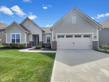 Charming single-Gathering home with a well-manicured lawn and a two-car garage at 5267 Chambers Ct, McCordsville, IN 46055