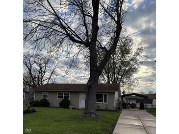 Charming single-story home with a well-maintained front lawn and inviting curb appeal at 212 Mooreland Dr, Whiteland, IN 46184