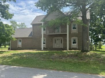 Traditional brick home with a balcony and a well-manicured lawn at 2365 E 850 N, Lebanon, IN 46052