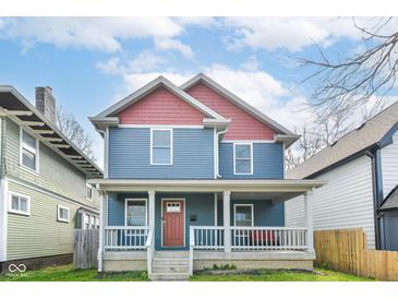 Charming two-story home features a welcoming front porch and a beautifully painted exterior at 2945 N New Jersey St, Indianapolis, IN 46205