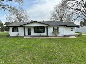 Charming single-story home with white siding and a well-manicured lawn at 2185 W State Road 234, Fortville, IN 46040
