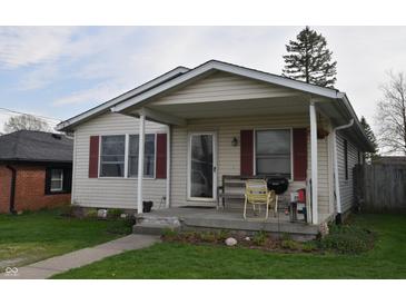 Charming home featuring a cozy front porch perfect for enjoying quiet mornings and relaxing evenings at 419 W Osage St, Greenfield, IN 46140