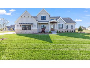 Beautiful two-story home with a well-manicured lawn, showcasing curb appeal at 8083 Easton Ln, Zionsville, IN 46077
