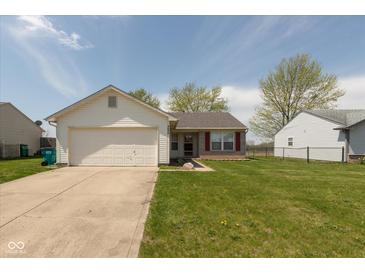 Charming single-Gathering home with a well-maintained front lawn and attached garage at 2680 Woodfield Blvd, Franklin, IN 46131