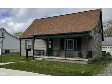 Charming bungalow-style home featuring a covered front porch, well-maintained lawn, and neutral siding at 518 N Grant St, Lebanon, IN 46052