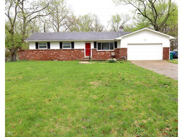 Charming ranch-style home featuring a brick facade, attached garage, and a red front door at 8017 Chiltern Dr, Indianapolis, IN 46268