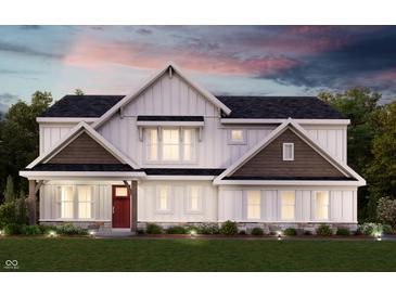 Charming two-story home with red front door, stone accents, and lush green lawn at 6217 Hampton Walk Blvd, McCordsville, IN 46055