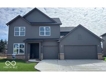 New construction, two-story home with a two car garage and gray siding and trim at 7215 Barrett Dr, Brownsburg, IN 46112