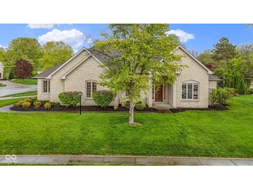 Charming, ranch-style home featuring manicured lawn and stone facade at 10794 Pine Needle Ct, Fishers, IN 46037