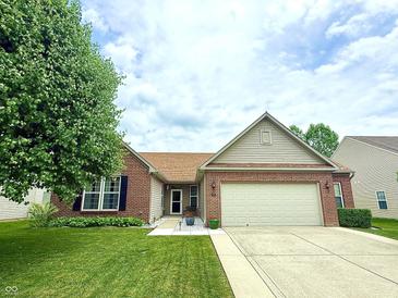 Charming single-story home with brick and siding exterior, well-manicured lawn, and two car garage at 1649 Woodfield Dr, Greenwood, IN 46143
