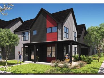 Modern home with a covered porch, dark gray siding, black trim, and a red accent wall at 1319 English Ave, Indianapolis, IN 46203