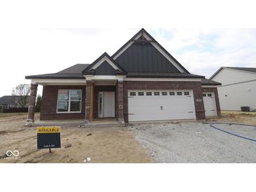 Beautiful single-story brick home with a two-car garage and covered porch at 5052 Carmine St, Brownsburg, IN 46112