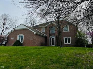 Traditional brick home with a well-manicured lawn and mature trees in a desirable location at 5773 Station Hill Dr, Avon, IN 46123