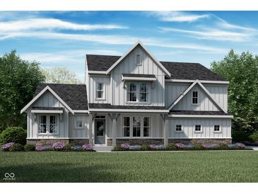 Charming two-story home with board and batten siding, stone accents, and a covered front porch at 11809 Sage Creek Bnd, Fishers, IN 46040