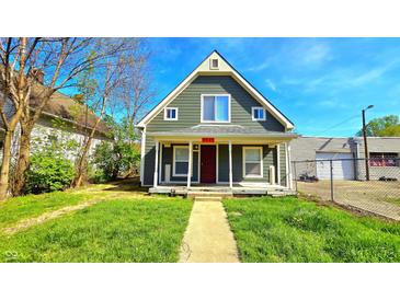Charming front exterior with a peaked roof, quaint porch, and well-maintained lawn at 3532 E 10Th St, Indianapolis, IN 46201