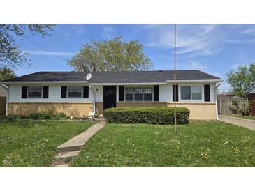 Charming ranch-style house with a well-maintained lawn and mature tree at 5636 W Henry St, Indianapolis, IN 46241