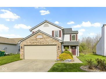 Charming two-story home with a brick-accented garage and well-maintained lawn at 2020 Tourmaline Dr, Westfield, IN 46074