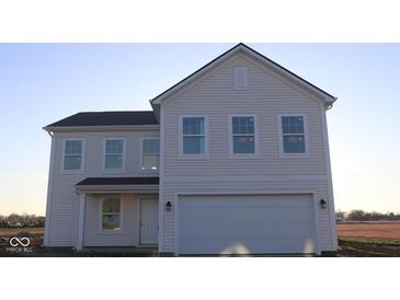 Charming new two-story home showcasing a symmetrical design with multiple windows and a two-car garage at 3832 Highcrest Rd, Indianapolis, IN 46239