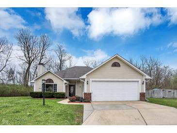 Charming single-story home with a well-maintained lawn and attached two-car garage at 4511 Hunt Master Ct, Indianapolis, IN 46268