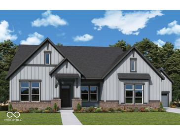 Charming two-story home featuring vertical siding, gray accents and a well-manicured lawn at 19590 Wood Farm Pl, Westfield, IN 46074