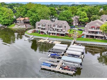 Waterfront townhomes feature private boat docks and lovely green spaces, perfect for lakeside living and enjoyment at 3646 Beach Blvd, Cicero, IN 46034
