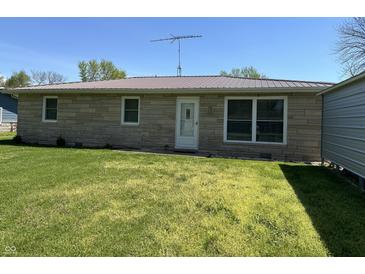 Charming single story home featuring stone facade, green lawn, and a well-maintained exterior at 3883 N 150 W, Columbus, IN 47201