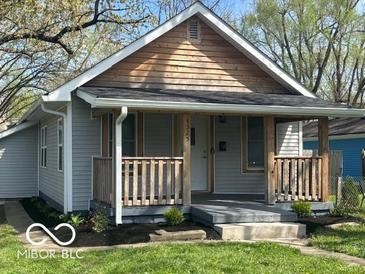 Charming single-Gathering home with a covered front porch and manicured lawn at 4325 Crittenden Ave, Indianapolis, IN 46205