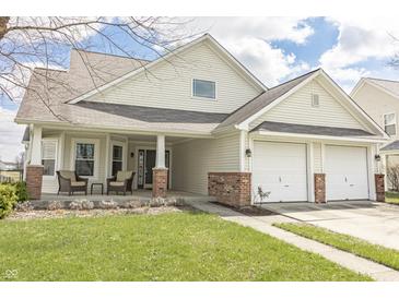 Inviting two-story home with a covered porch and a two-car garage at 5007 Avian Ln, Indianapolis, IN 46235