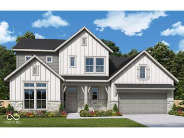 Charming two-story home boasts a modern farmhouse design with stone accents and a well-manicured lawn at 19522 Wood Farm Pl, Westfield, IN 46074
