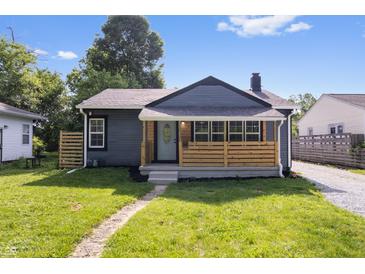 Charming single-story home featuring a welcoming front porch and fresh landscaping at 3541 N Linwood Ave, Indianapolis, IN 46218
