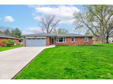 Charming brick ranch home with an attached garage and beautiful front lawn at 4464 Chatham Dr, Brownsburg, IN 46112