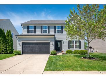Charming two-story home with a well-manicured lawn and two car garage at 3286 Hemlock St, Whiteland, IN 46184