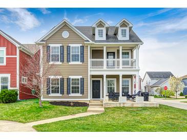 Charming two-story home featuring a covered front porch, black shutters, and well-maintained lawn at 5954 Crowley Pkwy, Whitestown, IN 46075
