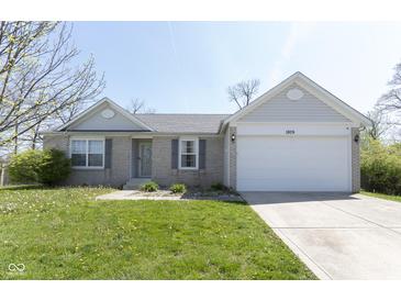 Charming single-story home featuring a two-car garage and well-maintained lawn at 1809 Ernest Ct, Indianapolis, IN 46234