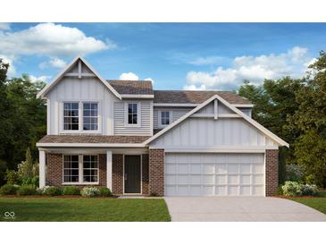 Charming two-story home featuring a brick and siding facade, inviting front porch, and attached two-car garage at 7125 Maidstone Cv, McCordsville, IN 46055