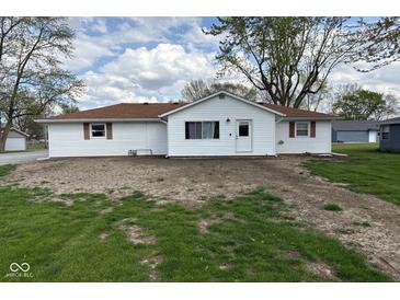 Charming ranch-style home featuring white siding, a brown roof, and well-maintained landscaping at 829 Washington Ave, Cicero, IN 46034